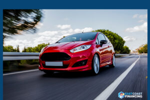 Red car moving on road